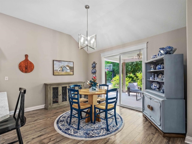 10805 Eagle River Run, Fort Wayne, IN 46845 - dining space featuring a chandelier, light wood-style floors, lofted ceiling, and baseboards