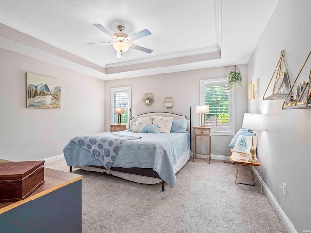 10805 Eagle River Run, Fort Wayne, IN 46845 - bedroom with a tray ceiling, light colored carpet, baseboards, ornamental molding, and a ceiling fan