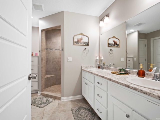 10805 Eagle River Run, Fort Wayne, IN 46845 - full bathroom featuring double vanity, a walk in shower, tile patterned flooring, and baseboards