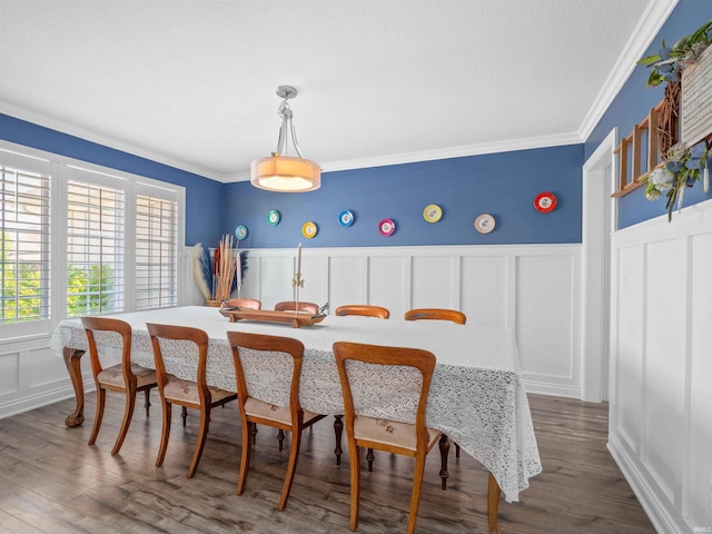 10805 Eagle River Run, Fort Wayne, IN 46845 - dining space with a decorative wall, ornamental molding, a wainscoted wall, and dark wood-style floors