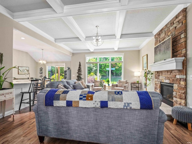 10805 Eagle River Run, Fort Wayne, IN 46845 - living area featuring a chandelier, wood finished floors, coffered ceiling, beamed ceiling, and a stone fireplace