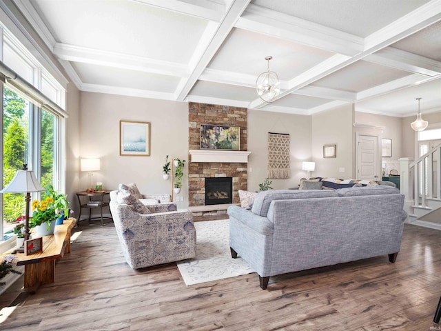 10805 Eagle River Run, Fort Wayne, IN 46845 - living room featuring coffered ceiling, a stone fireplace, wood finished floors, beam ceiling, and stairs