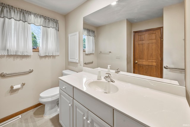 61587 Brompton Rd, South Bend, IN 46614 - bathroom featuring toilet, vanity, and baseboards