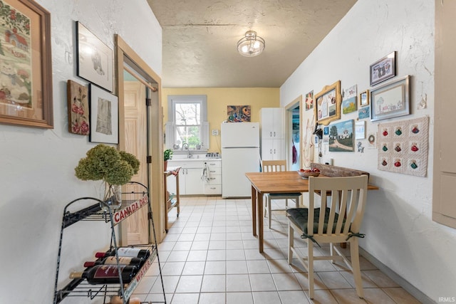 1712 High St, Fort Wayne, IN 46808 - dining area featuring light tile patterned flooring and a textured ceiling