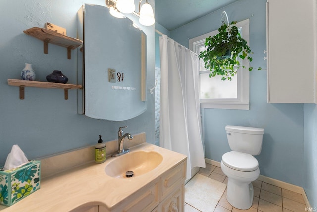 1712 High St, Fort Wayne, IN 46808 - full bathroom with toilet, vanity, tile patterned flooring, baseboards, and a shower with shower curtain