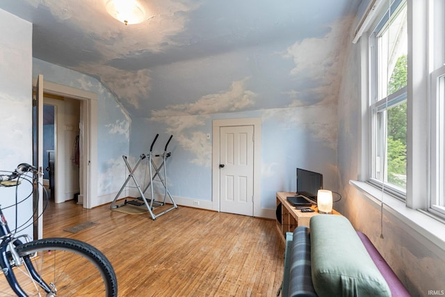 1712 High St, Fort Wayne, IN 46808 - workout room featuring light wood-style flooring, lofted ceiling, and baseboards