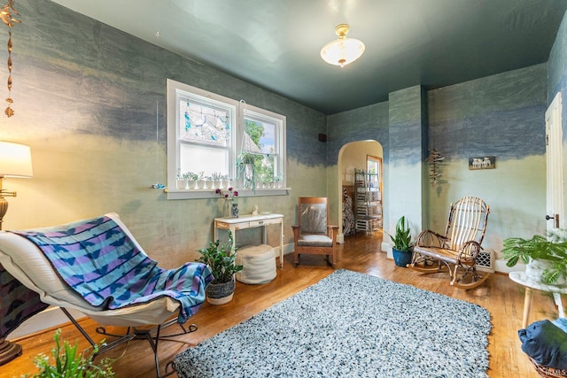 1712 High St, Fort Wayne, IN 46808 - sitting room featuring arched walkways and wood finished floors