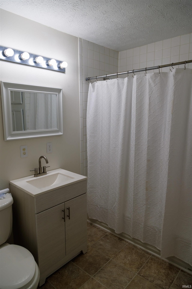 3289 S State Road 37th Rd, Paoli, IN 47454 - bathroom featuring toilet, a textured ceiling, vanity, and shower / bath combo with shower curtain