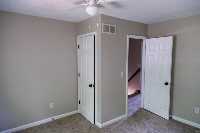 3289 S State Road 37th Rd, Paoli, IN 47454 - unfurnished bedroom with carpet floors, baseboards, and a ceiling fan