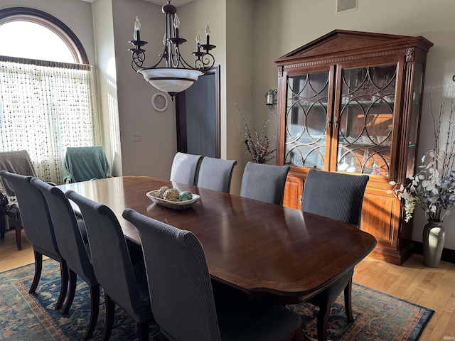 5533 N 150 Rd E, Urbana, IN 46990 - dining area with wood finished floors and a chandelier