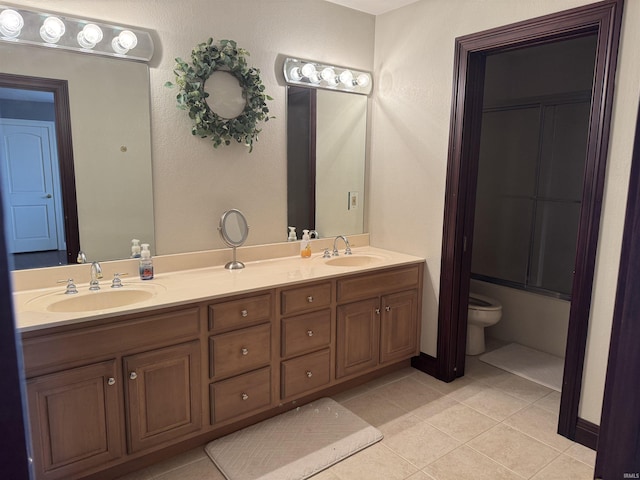 5533 N 150 Rd E, Urbana, IN 46990 - full bath with double vanity, toilet, and tile patterned flooring