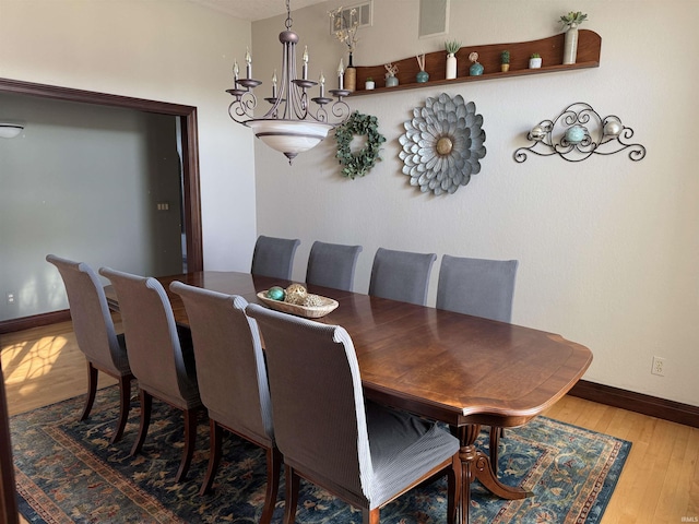 5533 N 150 Rd E, Urbana, IN 46990 - dining area with wood-type flooring and baseboards