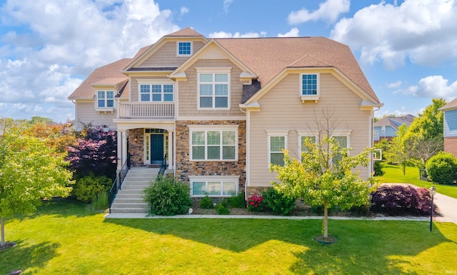10555 Serra Vista Pt, Fishers, IN 46040 - view of front of home featuring stone siding and a front lawn
