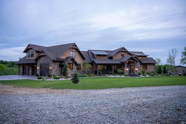 8615 W 450 S, Hudson, IN 46747 - craftsman inspired home featuring stone siding, gravel driveway, a front yard, and an attached garage