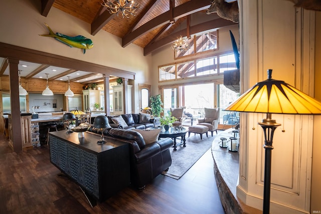 8615 W 450 S, Hudson, IN 46747 - living area with a chandelier, wooden ceiling with exposed beams, dark wood-type flooring, high vaulted ceiling, and decorative columns