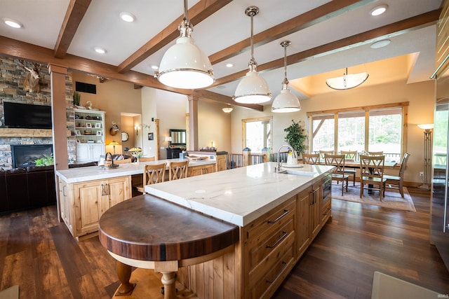 8615 W 450 S, Hudson, IN 46747 - kitchen featuring a spacious island, open floor plan, a sink, dark wood-style floors, and beam ceiling