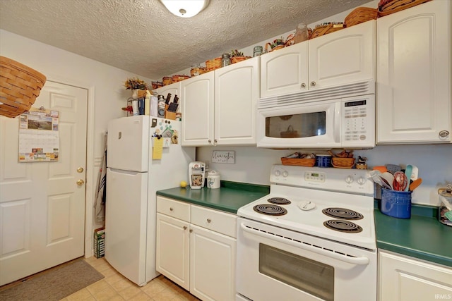 2881 S Walnut St Pike, Bloomington, IN 47401 - kitchen with white appliances, white cabinets, a textured ceiling, and dark countertops
