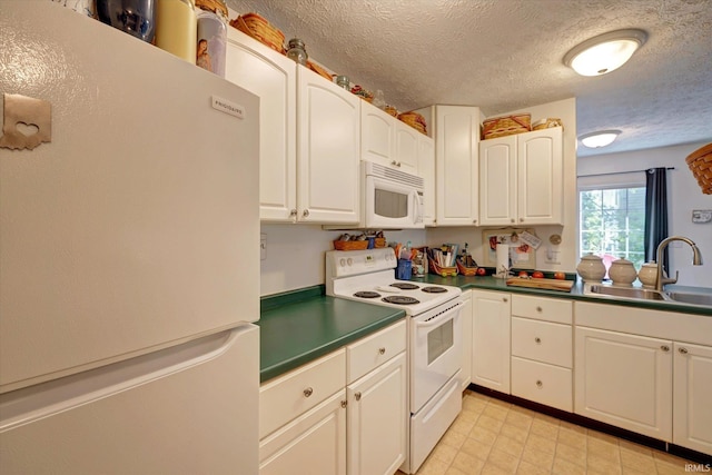 2881 S Walnut St Pike, Bloomington, IN 47401 - kitchen with white appliances, a sink, a textured ceiling, white cabinetry, and dark countertops