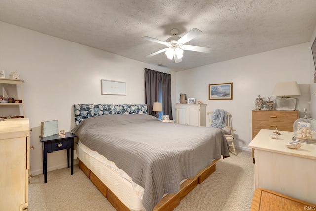 2881 S Walnut St Pike, Bloomington, IN 47401 - bedroom with light colored carpet, a textured ceiling, a ceiling fan, and baseboards