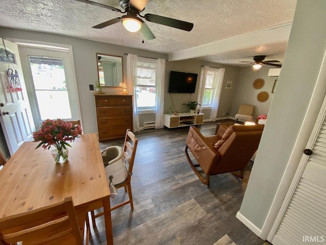 138 N Harrison St, Bloomfield, IN 47424 - dining space featuring a textured ceiling, ceiling fan, wood finished floors, and baseboards