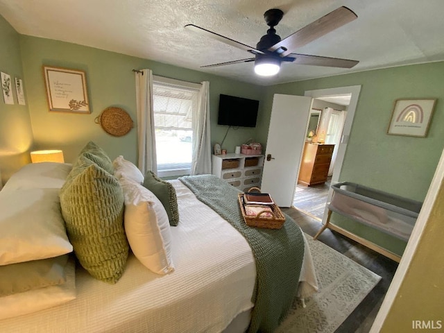 138 N Harrison St, Bloomfield, IN 47424 - bedroom featuring wood finished floors, a ceiling fan, and a textured ceiling