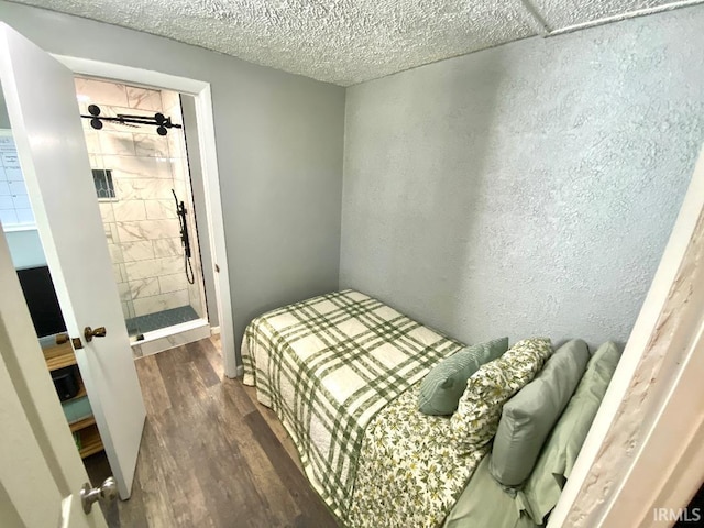 138 N Harrison St, Bloomfield, IN 47424 - bedroom featuring wood finished floors and a textured ceiling