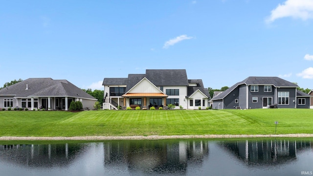 5272 Greyson Heights Dr, Auburn, IN 46706 - rear view of house with a water view, a yard, and a standing seam roof