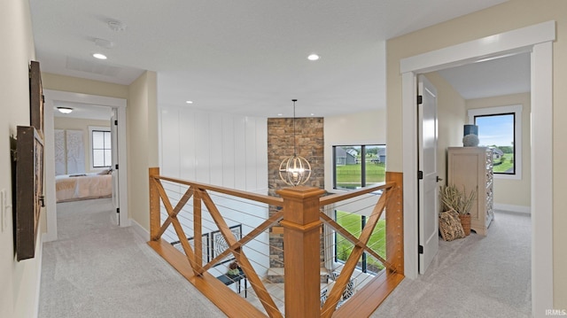5272 Greyson Heights Dr, Auburn, IN 46706 - hall featuring an upstairs landing, light carpet, a chandelier, baseboards, and recessed lighting