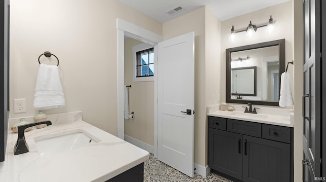 5272 Greyson Heights Dr, Auburn, IN 46706 - bathroom featuring two vanities and tile patterned floors