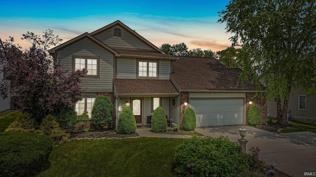 16316 Thunderbird Rd, Huntertown, IN 46748 - traditional-style home featuring driveway, an attached garage, a yard, roof with shingles, and brick siding