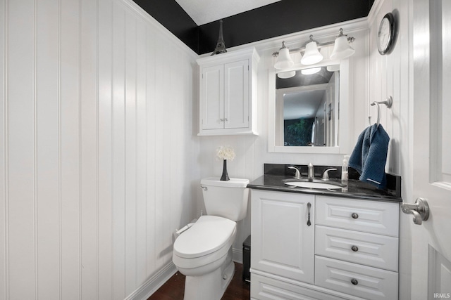 16316 Thunderbird Rd, Huntertown, IN 46748 - bathroom with vanity, toilet, and wood finished floors