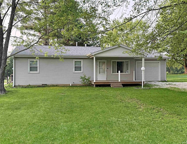 209 Acton St, Loogootee, IN 47553 - ranch-style home with covered porch, an attached garage, driveway, and a front lawn