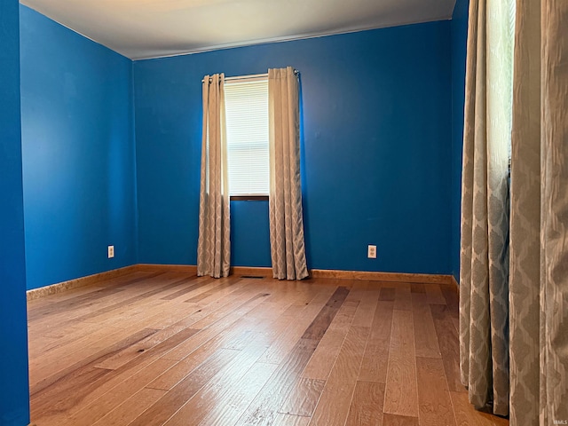 209 Acton St, Loogootee, IN 47553 - spare room with hardwood / wood-style floors and baseboards