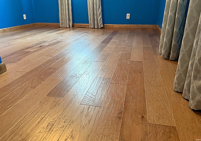 209 Acton St, Loogootee, IN 47553 - unfurnished room featuring wood-type flooring and baseboards