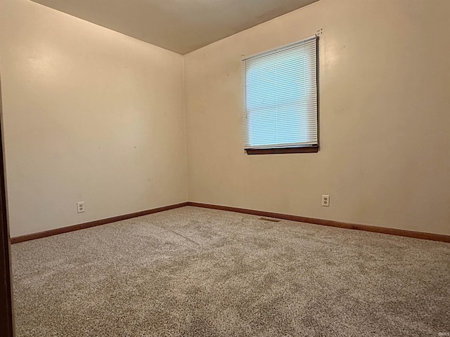 209 Acton St, Loogootee, IN 47553 - carpeted empty room featuring baseboards
