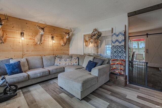 36 Jacks St, Gas City, IN 46933 - living room with wood finished floors, wooden walls, and a barn door