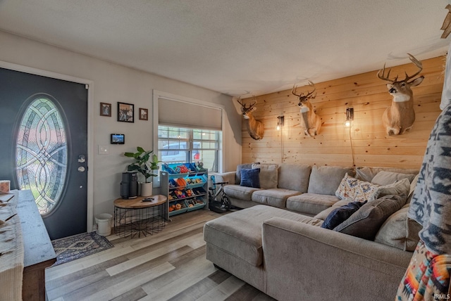 36 Jacks St, Gas City, IN 46933 - living room featuring wood finished floors, wooden walls, and a textured ceiling