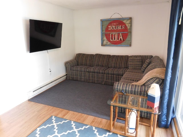 9381 E Promontory Point Dr, Syracuse, IN 46567 - living area featuring baseboard heating and wood finished floors