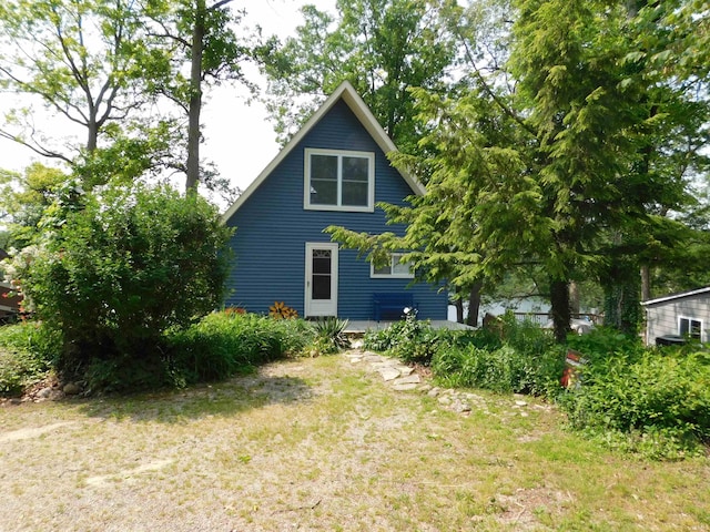 9381 E Promontory Point Dr, Syracuse, IN 46567 - view of side of property featuring a lawn