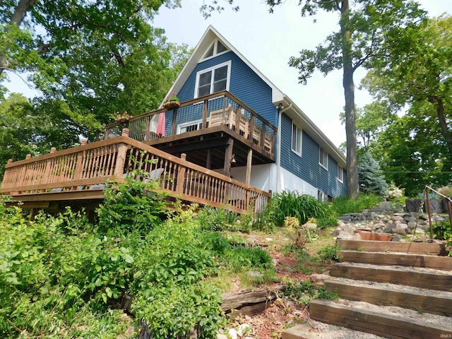 9381 E Promontory Point Dr, Syracuse, IN 46567 - back of property featuring stairway and a deck