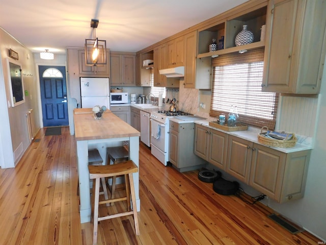 9381 E Promontory Point Dr, Syracuse, IN 46567 - kitchen with white appliances, open shelves, butcher block counters, a sink, and light wood-style flooring