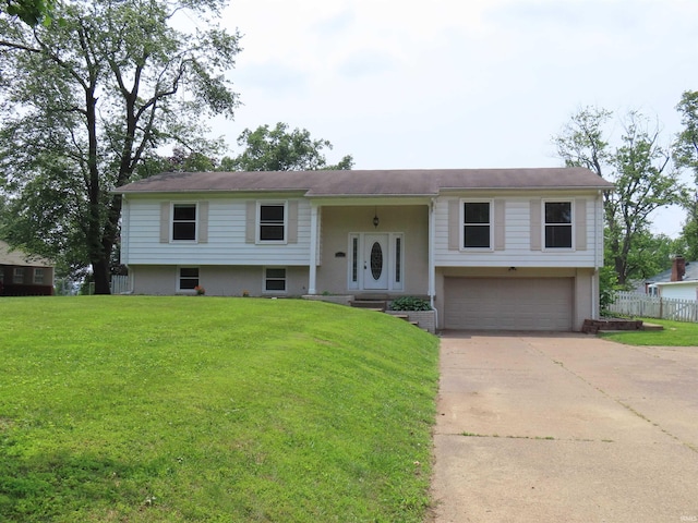 3910 Stringtown Rd, Evansville, IN 47711 - split foyer home featuring an attached garage and concrete driveway