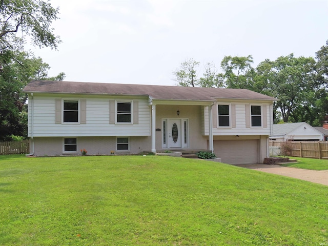 3910 Stringtown Rd, Evansville, IN 47711 - split foyer home with an attached garage and concrete driveway