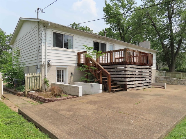 3910 Stringtown Rd, Evansville, IN 47711 - back of property featuring a deck, stairway, and a patio area