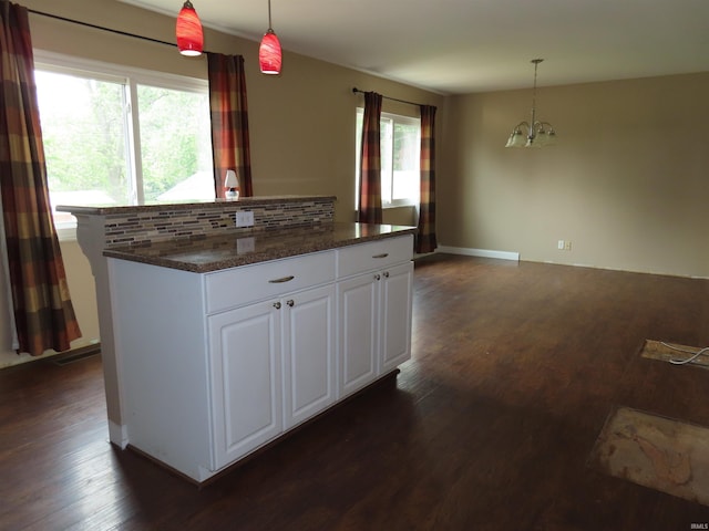3910 Stringtown Rd, Evansville, IN 47711 - kitchen featuring healthy amount of natural light, a chandelier, dark wood-style floors, and dark countertops