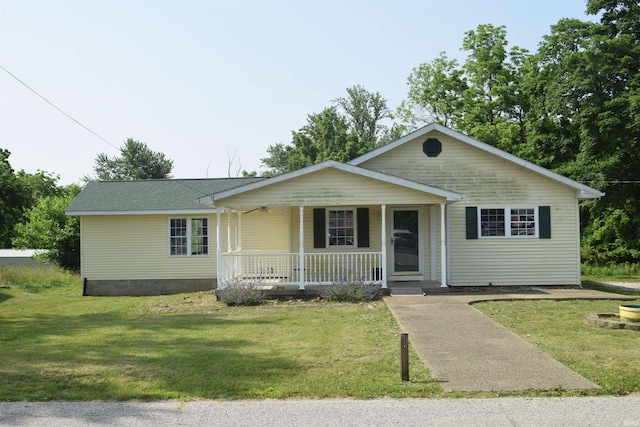 2104 Norton Ln, Bedford, IN 47421 - view of front of home with a porch, a front yard, and roof with shingles