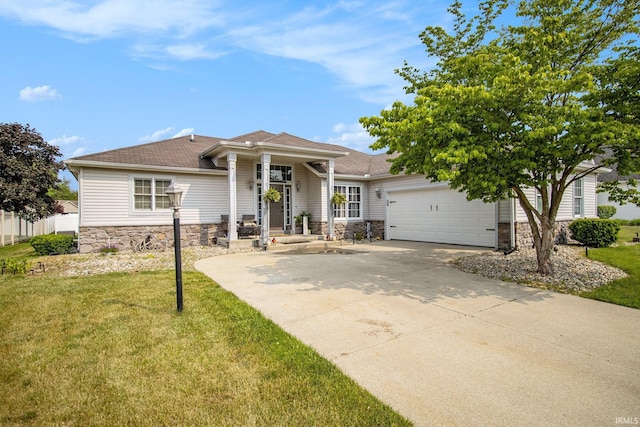 55705 Sichuan Dr, Osceola, IN 46561 - view of front of house featuring stone siding, concrete driveway, a garage, and a front yard