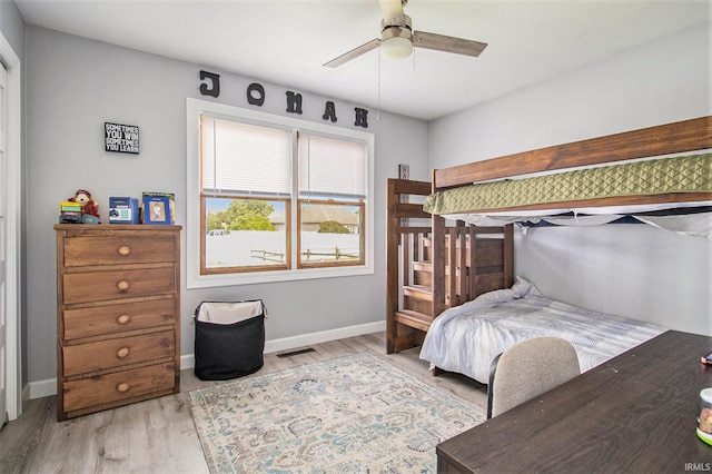 55705 Sichuan Dr, Osceola, IN 46561 - bedroom with light wood finished floors, baseboards, and a ceiling fan
