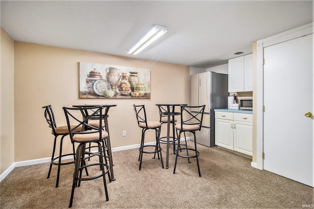 55705 Sichuan Dr, Osceola, IN 46561 - dining room with light carpet and baseboards