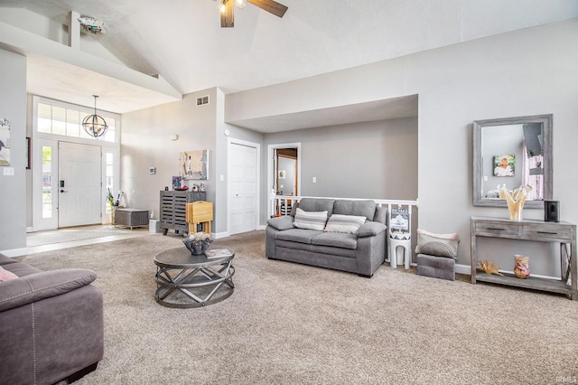 55705 Sichuan Dr, Osceola, IN 46561 - carpeted living room featuring high vaulted ceiling, a ceiling fan, baseboards, and a chandelier
